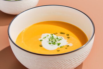 Pumpkin Cream Soup with Coconut Milk Garnished with Microgreens