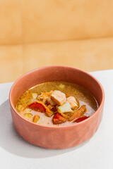 Delicious Fish Soup with Two Varieties of Fresh Fish in a Rustic Bowl