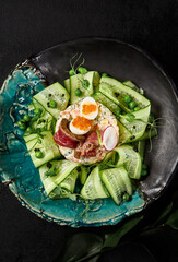 Gourmet Olivier Salad with Roast Beef and Fresh Cucumbers on Elegant Tableware