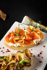 Gourmet Bruschetta Assortment with Crab, Salmon & Avocado and Roast Beef on Elegant Tableware
