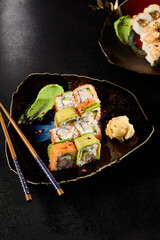 Exquisite Sushi Roll Platter with Salmon, Shrimp, Avocado on Elegant Dark Table