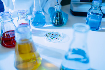 Modern medical research laboratory. female scientist hands working with micro pipettes analyzing biochemical samples