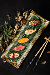 Elegant Assortment of Sushi with Salmon, Tuna, Shrimp, Eel, and Scallop on a Chic Platter