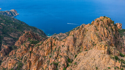 Aerial drone view Piana red rocks at the mediterranean sea, island of Corsica, France.