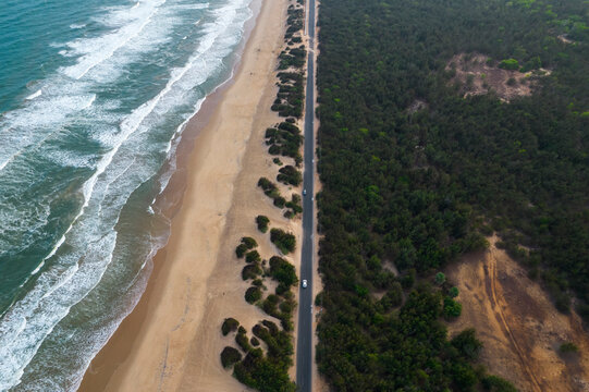 Aerial view of rough sea waves rolling onto Chandrabhaga beach, Konark, Odisha, India.