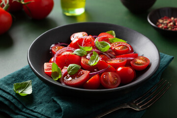 healthy tomato salad with onion basil olive oil and balsamic vinegar