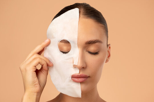 Beauty routines. Closeup of young lady removing textile sheet mask from facial skin, enjoying result of skin treatments, beige background