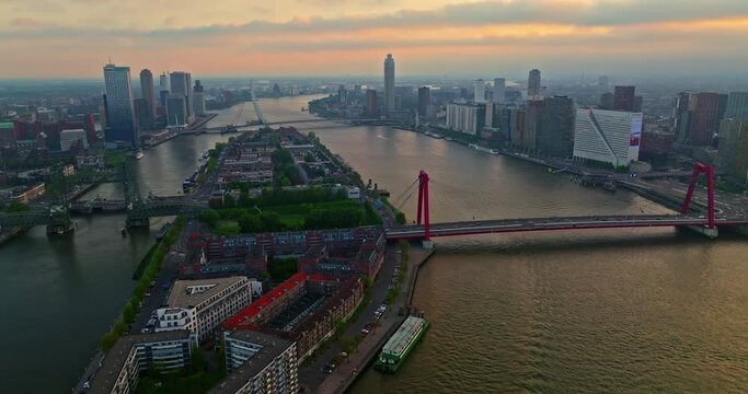 Aerial view Rotterdam, Netherlands. Willemsbrug Bridge. Noordereiland Island. View of the city center. River Nieuwe Maas. Sunset