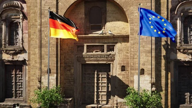 Parete storica con bandiera Germania e bandiera Unione Europea