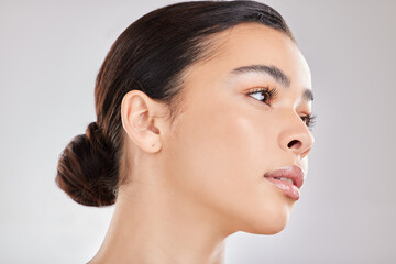 Fototapeta premium Thinking, face and woman with skincare from beauty or dermatology in studio background. Healthy, girl and calm model relax with natural glow on skin from cosmetics, makeup or ideas for treatment