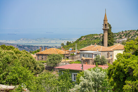 Charming Village in Troas Region, Turkey with Traditional Houses and a Minaret Overlooking the Aegean Sea