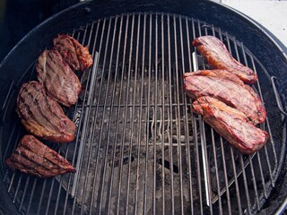 Sirloin cap steaks, also called picanha, smoked and grilled on the old-fashioned kettle charcoal grill