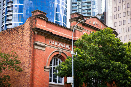old 1800's building in the city surrounded my modern buildings