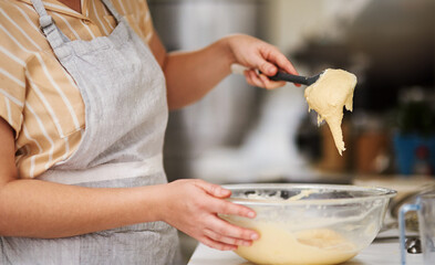 Woman, hands and cake batter with bowl in kitchen for cookies, bread and breakfast in cafe. Female baker, cooking and dessert for bakery, small business and pastry chef in coffee shop for career