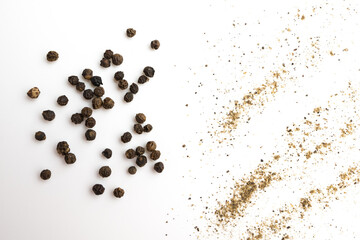 Black pepper grains and powder isolated