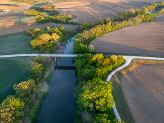 sunrise over farmland and the Lamine River at Roberts Bluff access in Missouri, springtime aerial...