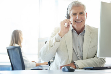 Mature man, talking and call center with customer service for communication, support or headset....
