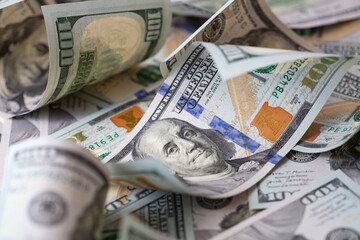 cuved U.S. 100 dollar banknotes background