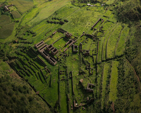 Aerial view of green agricultural fields near Huchuy Qosqo, Inca ruins, Lamay, Calca, Departamento del Cuzco, Peru.