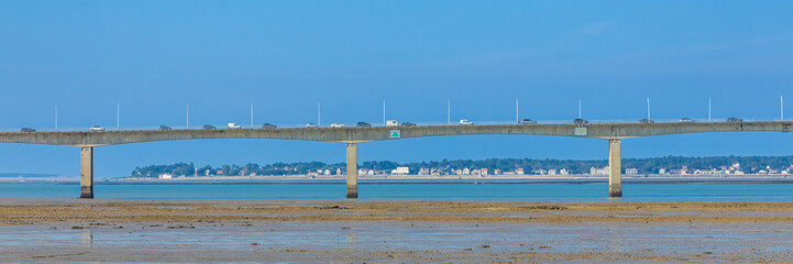 Fototapeta premium Traffic on the bridge of Oleron island on a sunny day in Bourcefranc-le-Chapus, France