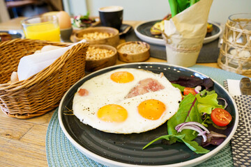 Ham and eggs with vegetables on a brunch table