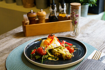 Top down of Avocado toast with fried eggs and vegetables