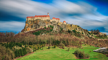 Historic Riegersburg Castle, Medieval Fortress on Hilltop, Austria, Scenic Landscape with Clouds