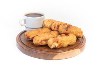 aborrajado and coffe over a wood table isolated white