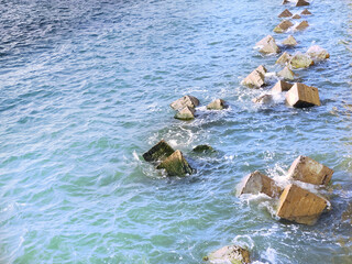 Concrete breakwater blocks on the coastline