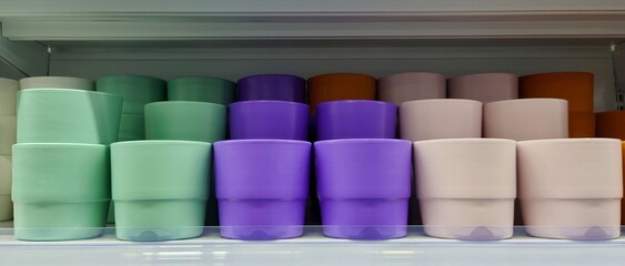 Assorted colorful plant pots arranged on a store shelf