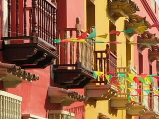 traditional colorful buildings with wooden balconies in Cartagena, Colombia 