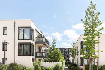 Residential area with ecological and sustainable green residential buildings, low-energy houses with apartments and green courtyard