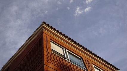 corner of residential house against the sky