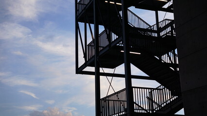 metal structure of stairs against the sky
