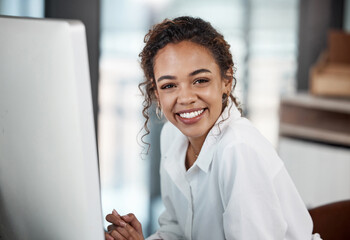 Portrait, smile and business woman on computer in office for career, job and startup company. Face, pc and happy professional entrepreneur, web designer or creative employee work on project in Brazil