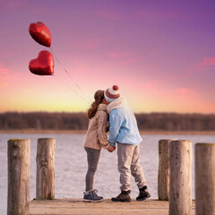 two cute kids with red heart balloons at the jetty in sunset