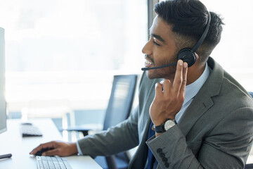 Call center, talking and man with headset in office for communication, customer support or service. Contact us, CRM and male consultant at desk for student aid, career guidance or scholarship advice