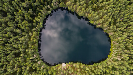 Aerial View of Latvian Lake Surrounded by Forest. Velnezers, Certoka ezers Aglona.