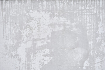 The surface of the gray wall is stained with wet spots. The stone texture of the street wall. With space to copy. High quality photo