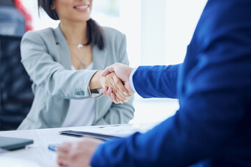 Car dealership, documents and people with handshake in showroom and contract, consulting and...