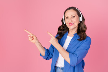 Photo portrait of attractive retired woman point empty space call center dressed stylish blue...