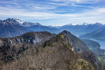 Wonderful views on a walk above the picturesque Lake Annecy. Route along the ridge from Mont Veyrier to Mont Baron from Annecy. Annecy, Haute-Savoie, France.