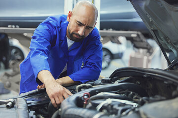 Mechanic, motor or man fixing car in service garage for transportation industry or inspection test....
