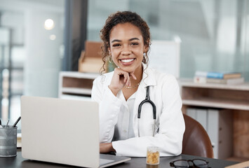 Doctor, smiling or portrait with laptop on desk for virtual appointment, schedule or online...