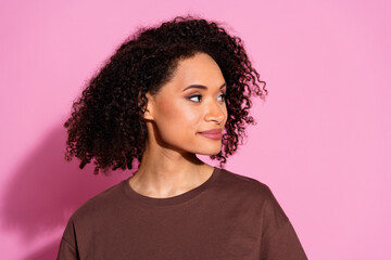 Portrait of pretty young lady look empty space wear brown t-shirt isolated on pink color background