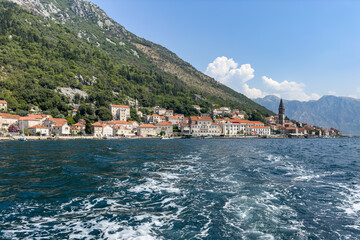 Fototapeta premium Charming Perast Town on Kotor Bay With Majestic Mountain Backdrop, Montenegro