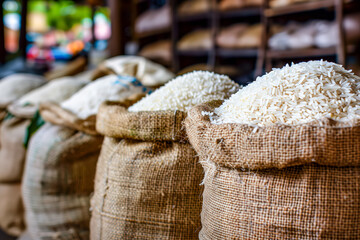 Obraz premium Multiple bags of rice arranged on market shelf