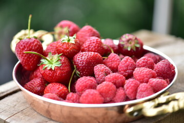 Fresh red fruits on a plate