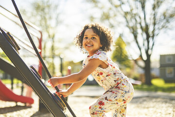 Naklejka premium Happy kid on playground on summer season