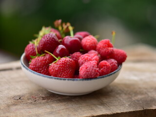 Organic red fruits in a bowl in a bowl
